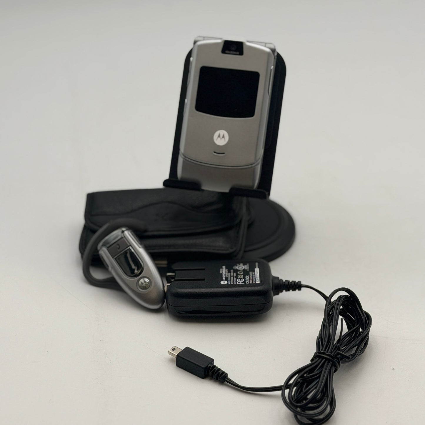 Motorola Razr V3 Silver Flip Phone with Bluetooth Earpiece & Accessories