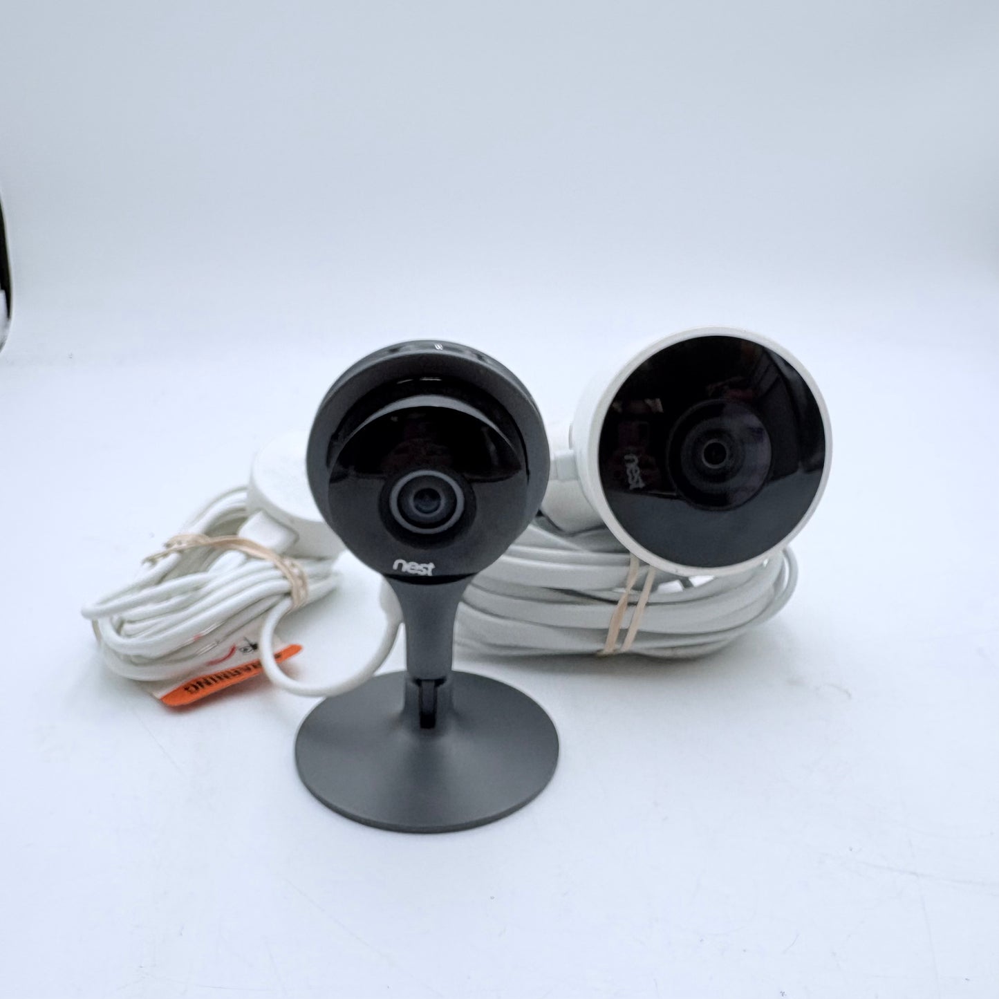 Lot of two of Google Nest Cameras, one indoor and the other outdoor. READ