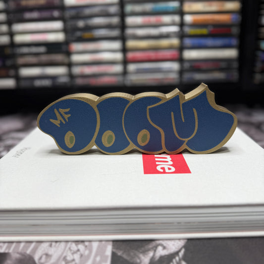 MF DOOM Graffiti Tag Decor in Navy/Brass/Green