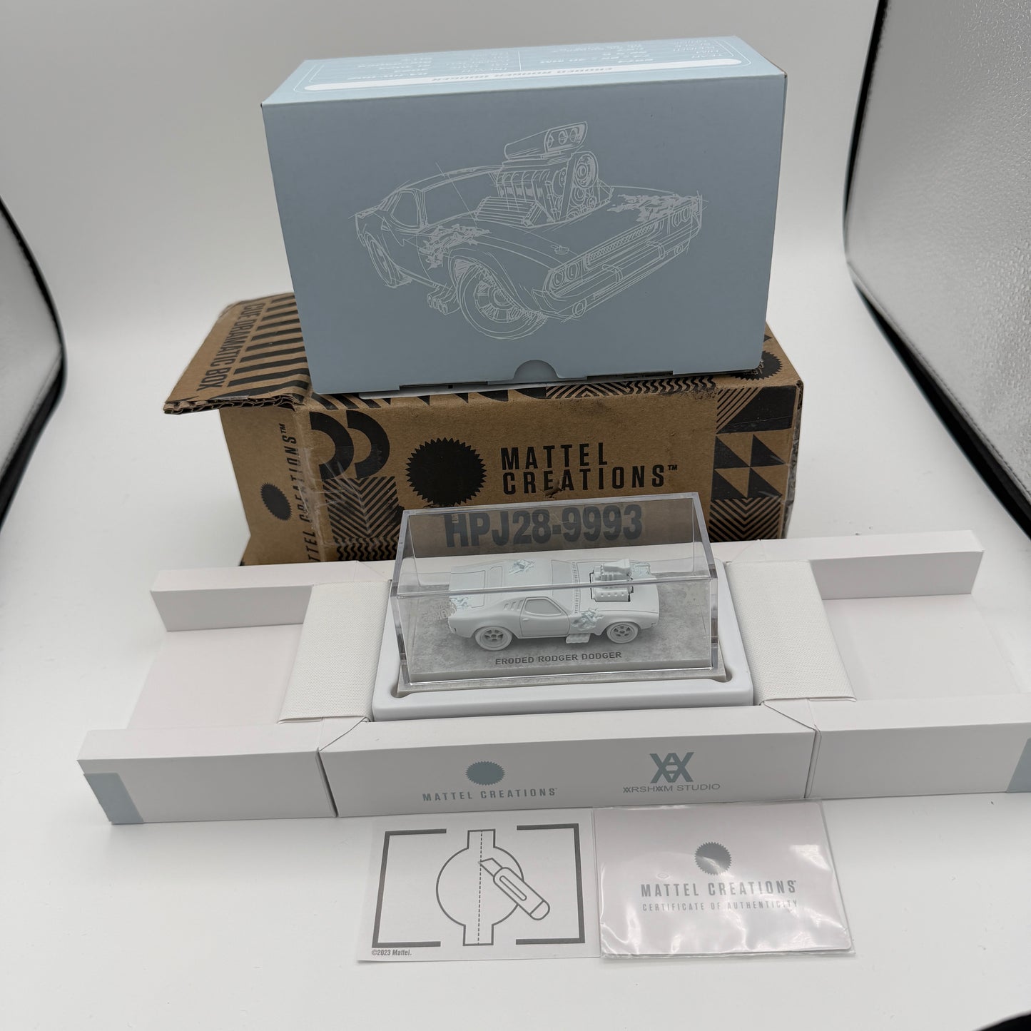 Mattel Creations Hot Wheels x Daniel Arsham Eroded Rodger Dodger HPJ28-9993 Silver Collectible